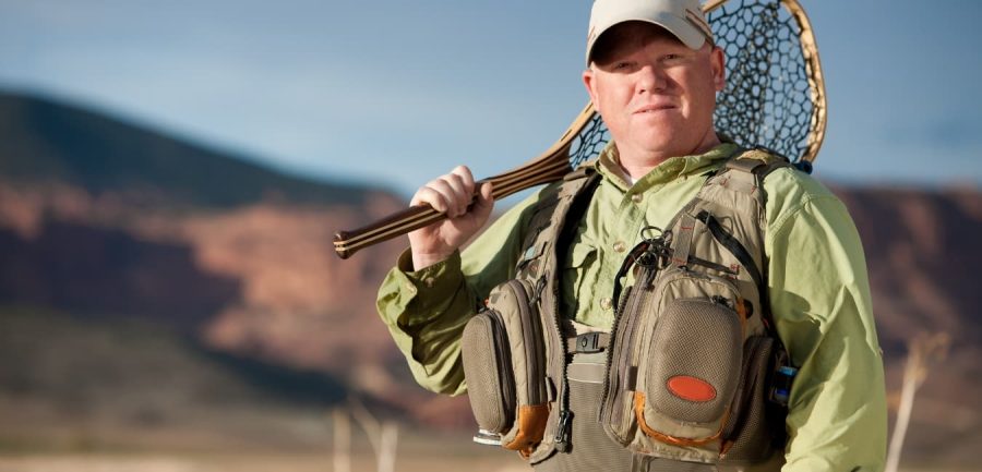 man holding fly fishing net