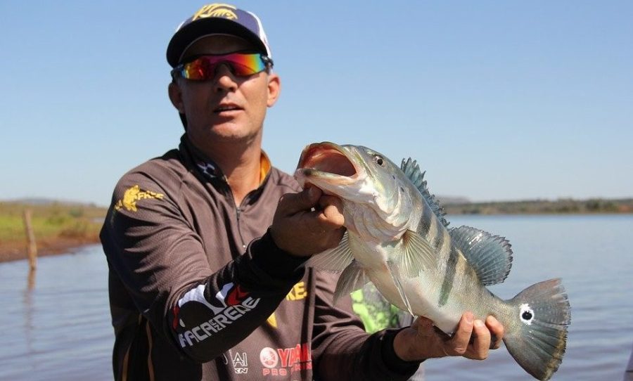 Angler with bass in hand